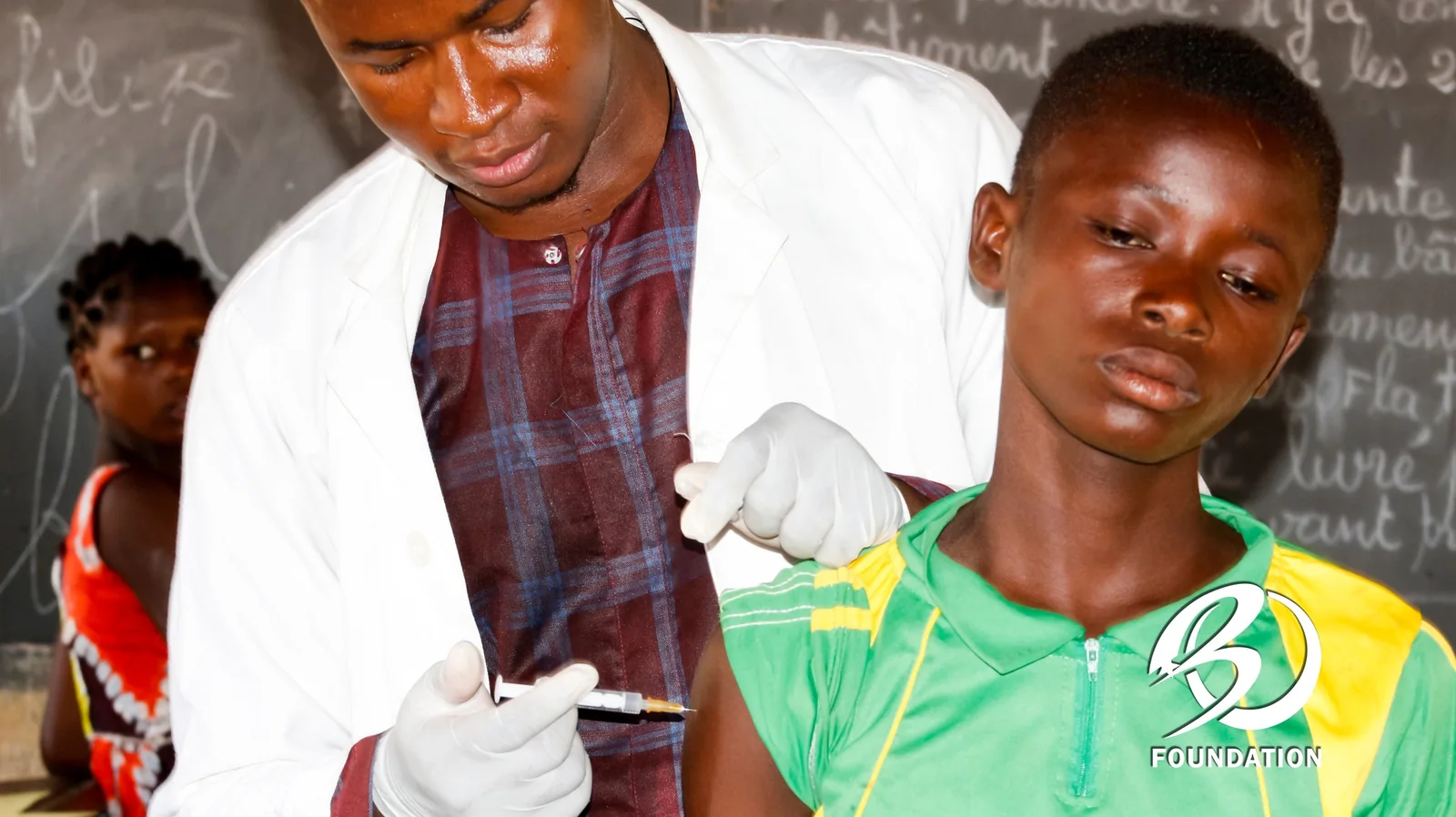 A health professional caring for a student during a school visit.